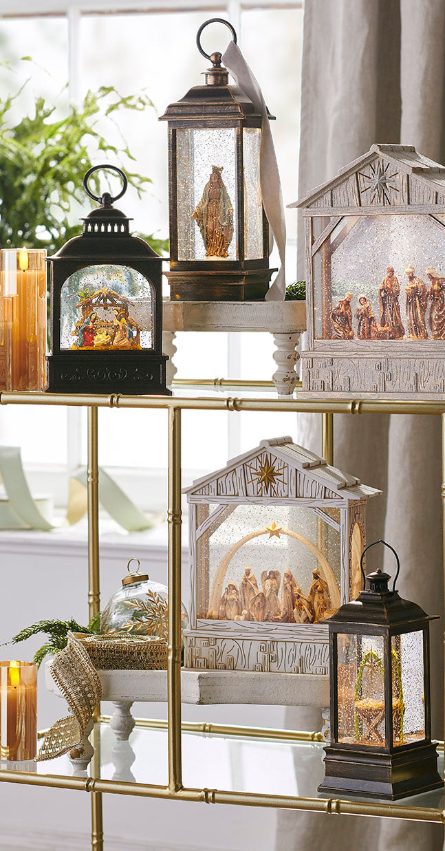 Nativity snow globes arraigned on a decorative shelf
