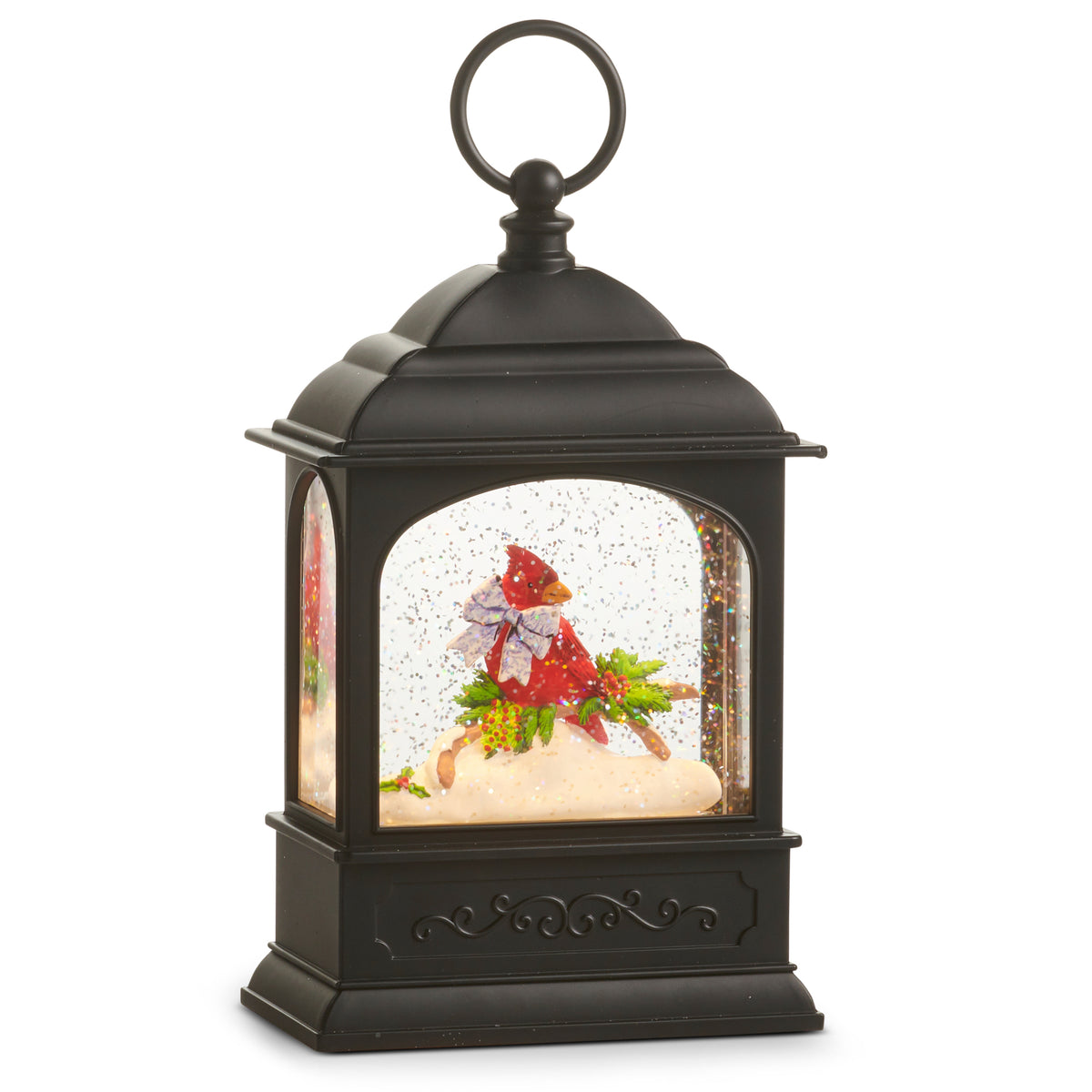Black lantern-shaped snow globe with a cardinal Christmas scene inside on a white background