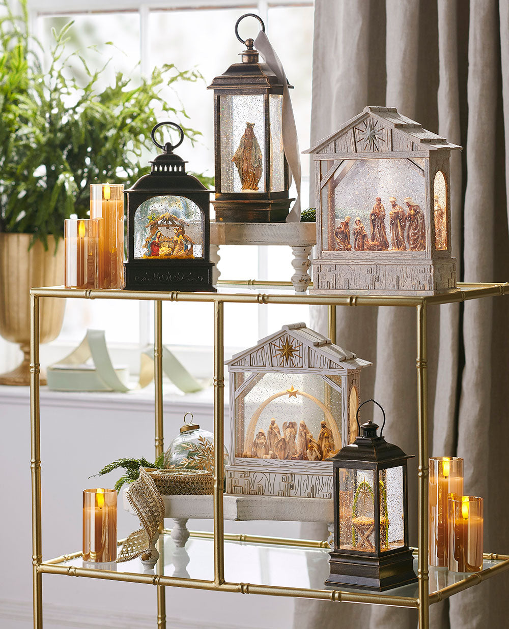 Nativity snow globes arraigned on a decorative shelf